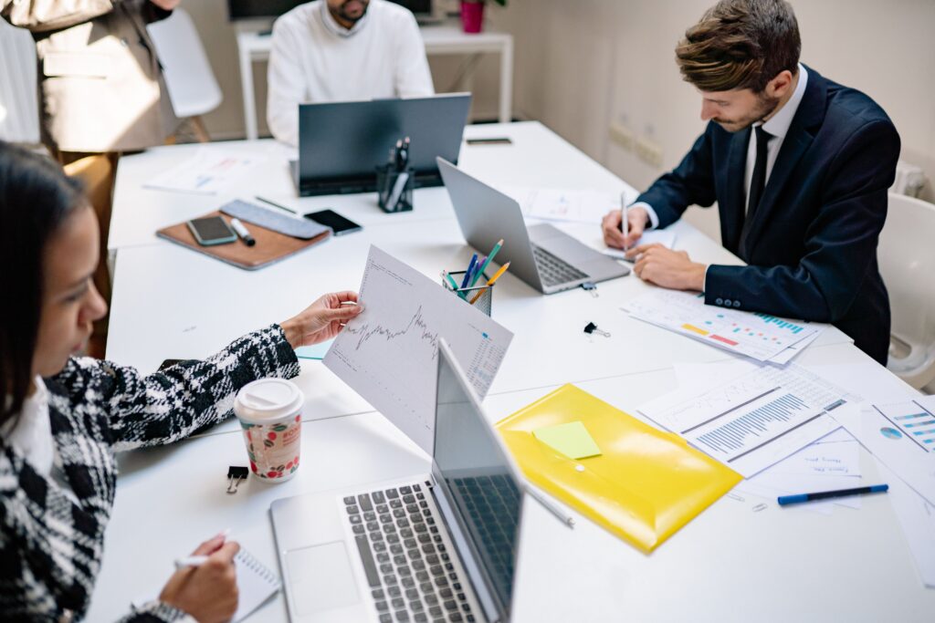 Business team using technology and managed IT services in Brisbane for daily operations